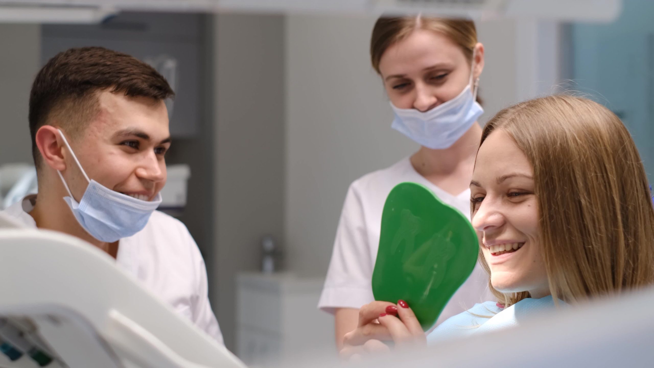 A smiling patient receiving a dental implant consultation at Implant & Cosmetic Dentistry of Northern Indiana in Fort Wayne, IN; phone 360-800-2013.